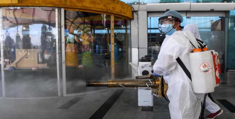 Volunteers spray disinfectant at Sri Guru Ram Dass Jee International Airport, Amritsar, India.  (Photo: AFP)