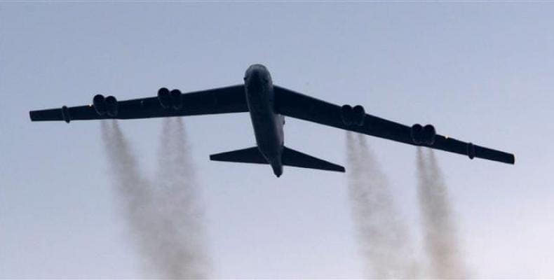 A B-52 bomber conducts a ceremonial fly-over above the Pentagon, May 28, 2017. (Photo by AFP)