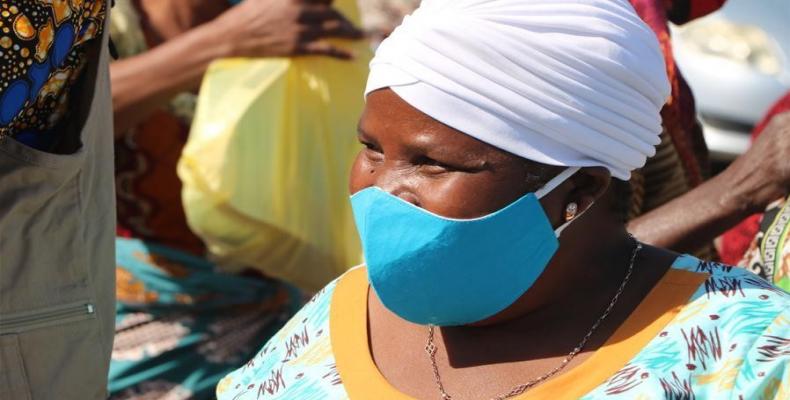 A woman attends a face mask distribution ceremony in Maputo, Mozambique, on July 31, 2020. The government of Maputo distributed some 13,000 face masks to 4,500