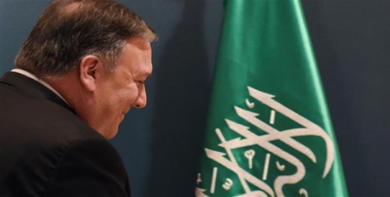 US Secretary of State Mike Pompeo leaves the press hall after giving a press briefing at the Royal airport in the Saudi capital Riyadh on April 29, 2018. (Photo