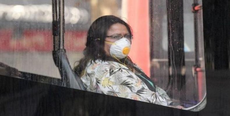 Woman wearing a face mask on a bus in Santiago de Chile, April 7, 2020.  (Photo: Xinhua)