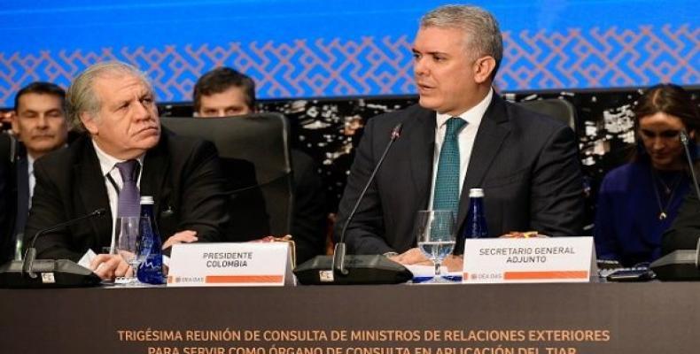 Colombia's President Ivan Duque speaks next to OAS General Secretary Luis Almagro, during TIAR meeting.   (Photo: Reuters)