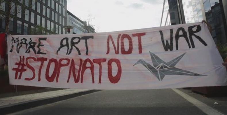 Activists rally against NATO's &quot;militarism&quot; as Trump calls for more military spending.  Photo: AP