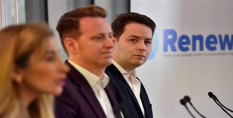 Sandra Khadhouri (L), together with fellow Renew Party members James Clarke (C) and James Torrance, speaks at the launch of the new political party in London, B