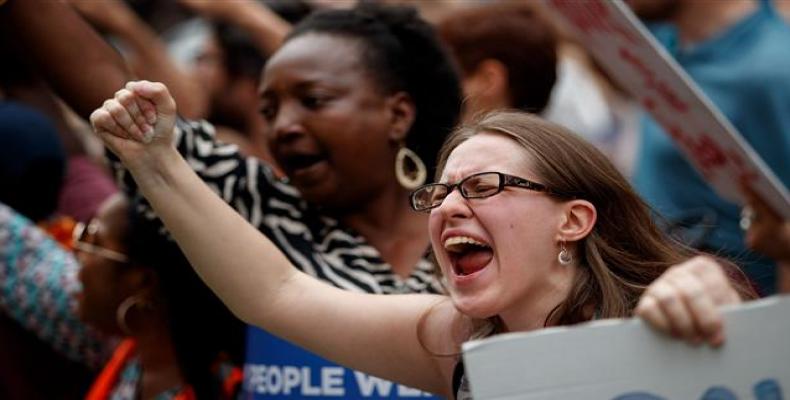 Activists rally outside of Trump World Tower to support immigrants and to mark World Refugee Day, June 20, 2018, in New York City.   Photo: AFP