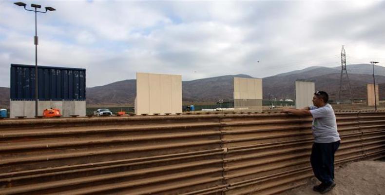 A man watches across the border from Tijuana, Mexico, to prototypes of US President Donald Trump's proposed wall on the border with Mexico, October 12, 2017. (P