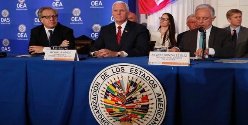 U.S. Vice President Pence sits between OAS Secretary General Almagro and President Gonzalez Diazas he waits to address the body in Washington.    Photo: Reuters