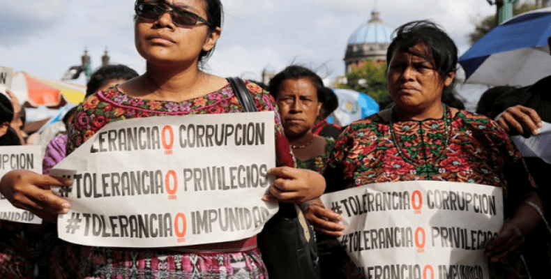 A group of women protest against the government of Jimmy Morales in front of the national palace in Guatemala City.  Photo: Reuters