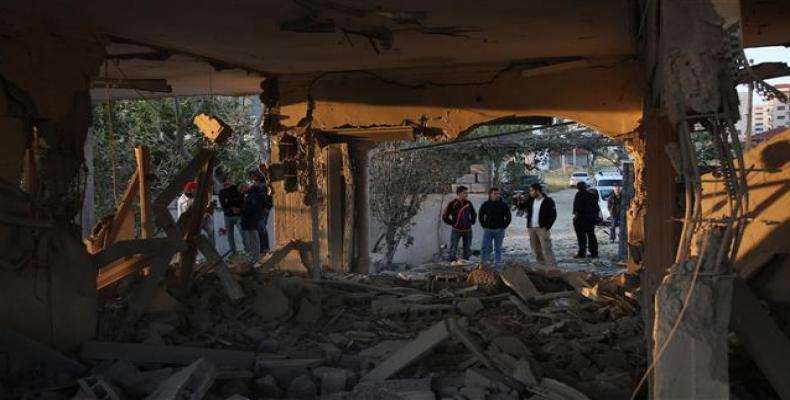 Palestinians check house after it was demolished by Israeli forces in the occupied West Bank city of Jenin on April 24, 2018.   Photo: AFP