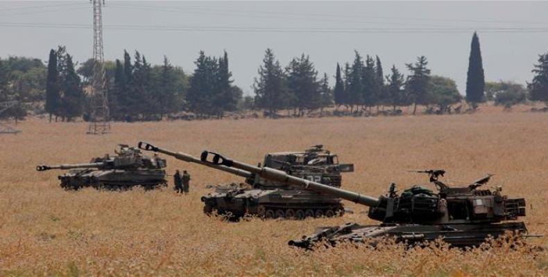 155 mm self-propelled howitzers deployed in the Upper Galilee in northern Israel on the Lebanese border.  (Photo: AFP)