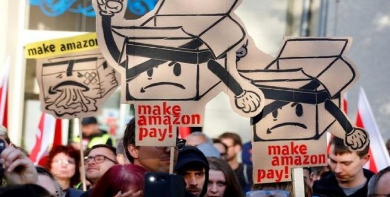 Amazon workers and activists protest ahead of the annual Axel Springer award ceremony in Berlin.   Photo: Reuters