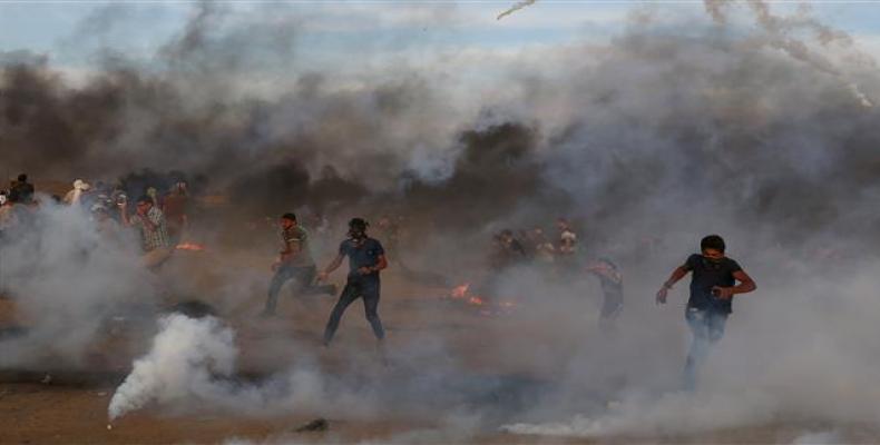 Clashes between Palestinians and Israeli forces across the fence, following a demonstration along the border between the Gaza Strip and the occupied territories