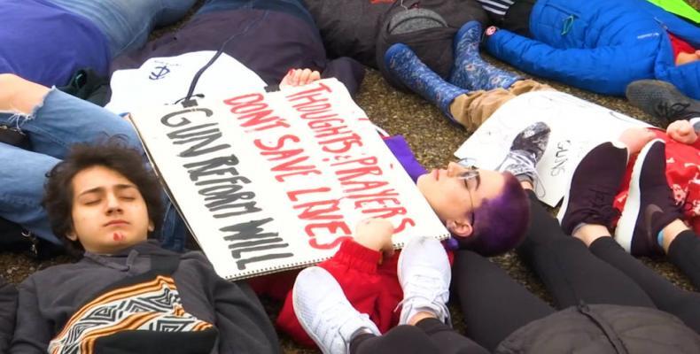 Students stage a lie-in to protest gun policies.  Photo: AFP