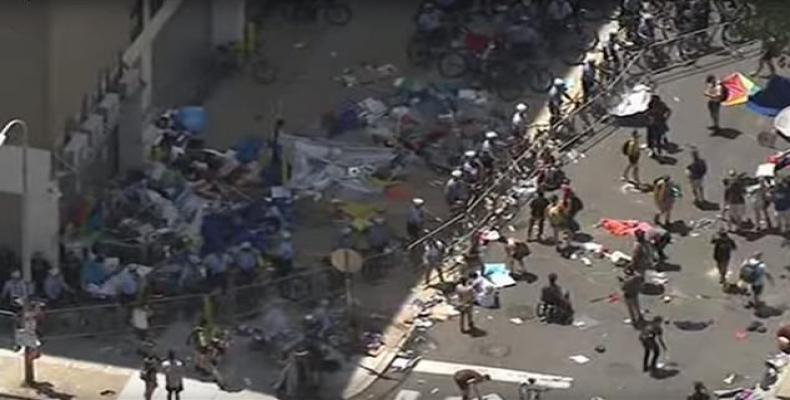 Police break up an encampment outside an Immigration and Customs Enforcement office in Philadelphia on Thursday, July 5, 2018.