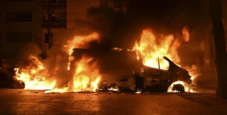 The photo posted on Twitter on January 2, 2018 purportedly shows a car on fire during riots that erupted in a Paris suburb overnight.  (Photo: Press TV)