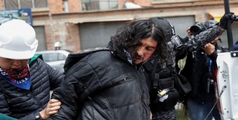 A man is detained during clashes between supporters of Evo and opposition in La Paz.  (Photo: Reuters)