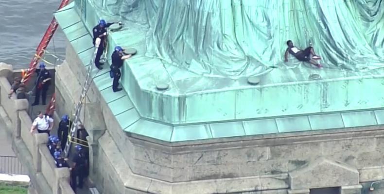 U.S. immigration activist who scaled Statue of Liberty found guilty.  Photo: Democracy Now