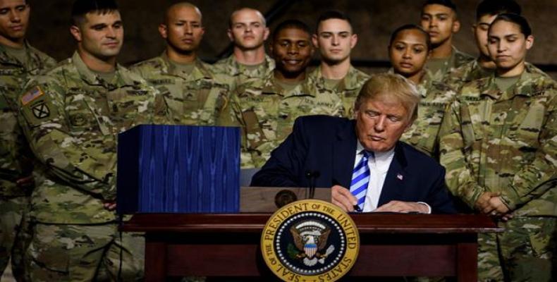 Donald Trump signs multi-billion dollar Pentagon spending bill.  Photo: AP