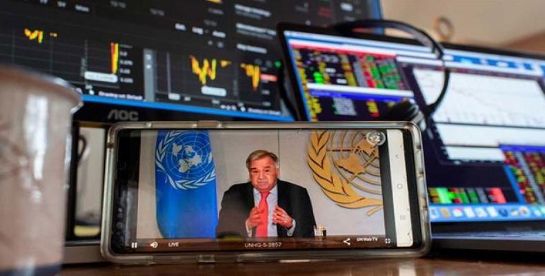 UN Secretary-General António Guterres is seen as briefing the media on the socio-economic impacts of the COVID-19 pandemic.