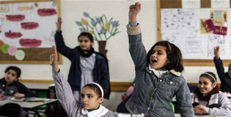 Palestinian schoolgirls attend a class at a school belonging to the United Nations Relief and Works Agency for Palestine Refugees (UNRWA) in Gaza City on Januar