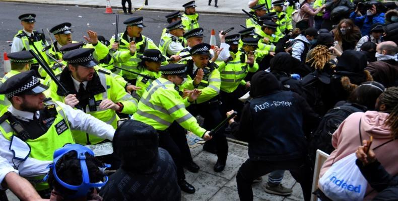 Police clash with demonstrators in Whitehall during a Black Lives Matter protest in London.  (Photo: Dylan Martinez/Reuters)