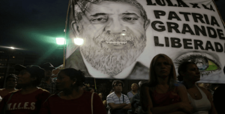 A flag with the image of former Brazilian President Luiz Inacio Lula da Silva is seen during a protest in support of Lula, in Buenos Aires, Argentina, April 11,