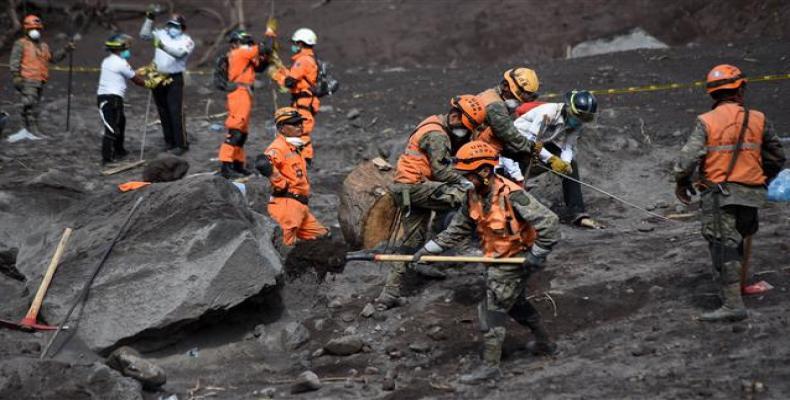 Rescue teams search through destruction wrought by volcano in Guatemala.  Photo: AP