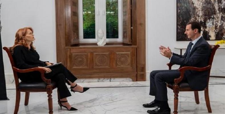 Syrian President Bashar al-Assad speaks in an interview with Italian TV channel Rai News 24.
