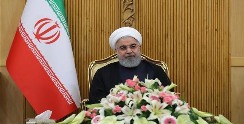 Iran's President Hassan Rouhani speaks at Mehrabad Airport on September 23, 2018, before leaving Tehran to attend the 73th session of the UN General Assembly in