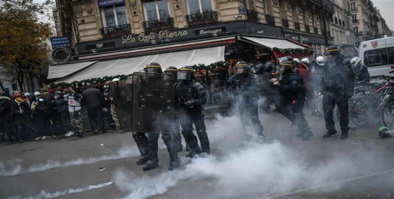 Police during a demonstration against French government's pensions reform plans in Paris.  (Photo: Reuters)