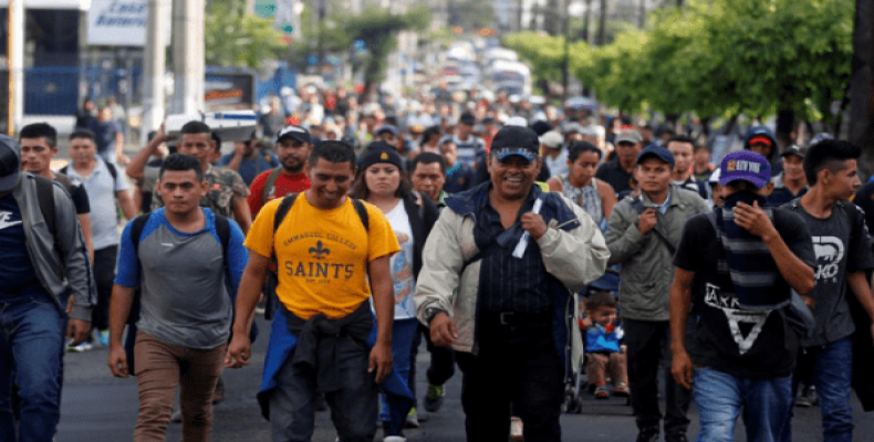 People walk in a caravan of migrants departing from El Salvador en route to the United States, in San Salvador, El Salvador, October 28, 2018.   Photo: Reuters
