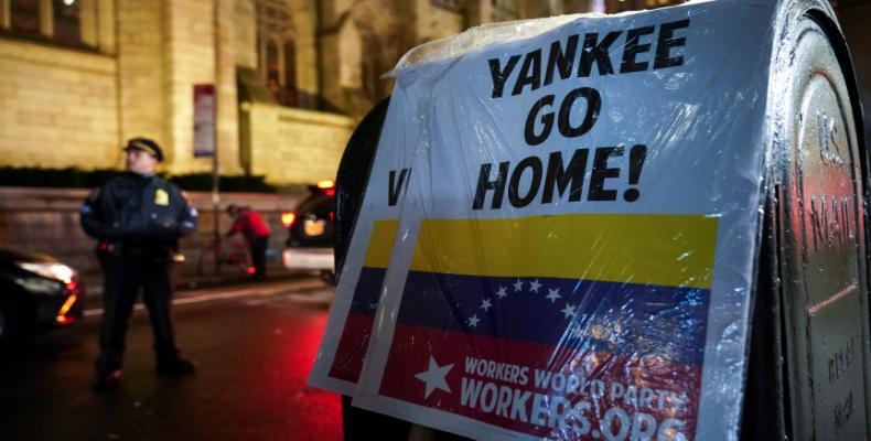 Drew Angerer/Getty Images File photo: Signs left by protestors signal support of Venezuelan President Nicolas Maduro outside the Venezuelan Consulate in Midtown