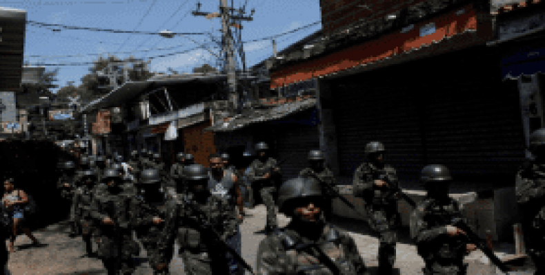 Armed Forces members patrol in Jacarezinho slum during an operation against drug gangs in Rio de Janeiro.   Photo: Reuters