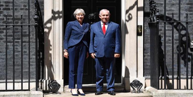 British Prime Minister Theresa May greets Israel's Prime Minister Benjamin Netanyahu outside 10 Downing Street in London on June 6, 2018.  Photo: AFP