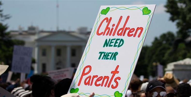 Tens of thousands protest separation of migrant families in U.S.   Photo: AP