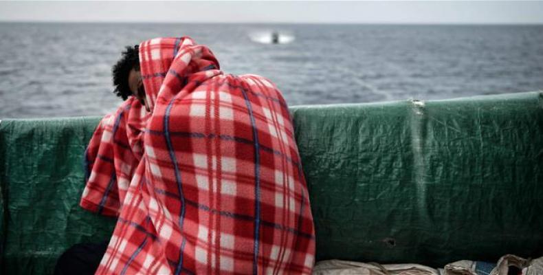  A refugee rests on the deck of the MV Aquarius as it sails into the Sicilian port of Messina.  Photo: AFP