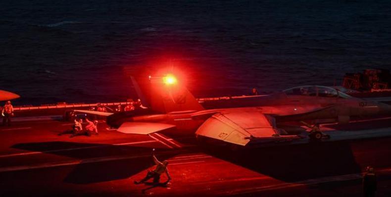 F-18 Hornet fighter jet waits to take off from the deck of the US navy aircraft carrier, the USS Harry S. Truman, in the eastern Mediterranean Sea on May 8, 201