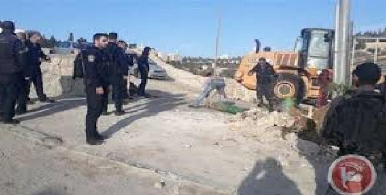 An Israeli bulldozer can be seen destroying a Palestinian property in the Silwan neighborhood in the West Bank.