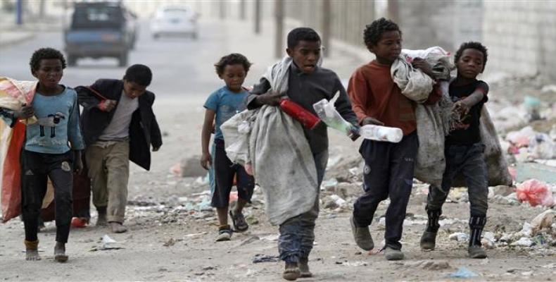 Children walk as they collect empty plastic bottles in a street in Sana'a, Yemen November 21, 2019. (Photo by Reuters)