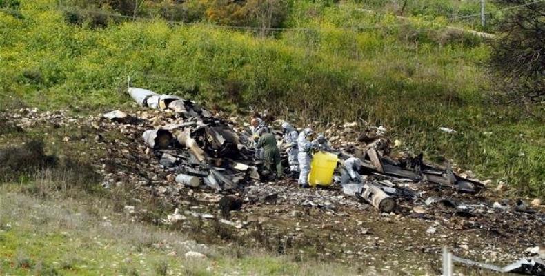 A picture taken in the northern Israeli Kibbutz of Harduf on February 10, 2018, shows the remains of an Israel F-16 that crashed after coming under fire by Syri