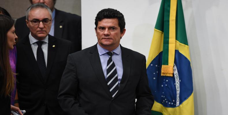 El ministro de Justicia, Sergio Moro, entrando a la rueda de prensa. 24 de abril. Brasilia.Evaristo SA / AFP El ministro de Justicia, Sergio Moro, entrando a la rueda de prensa. 24 de abril. Brasilia.Evaristo SA / AFP