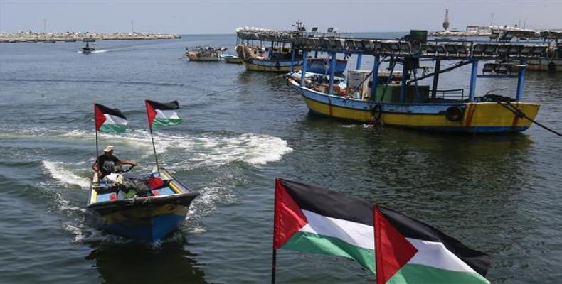 Palestinian fishermen are seen on their boats at the seaport of Gaza City on July 17, 2018.  Photo: AFP