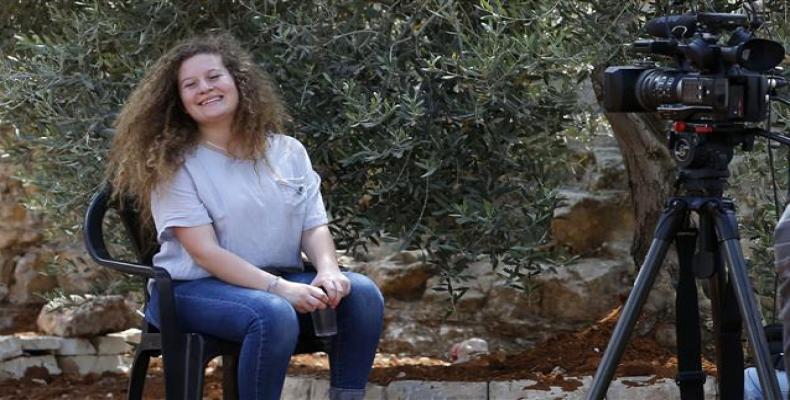 Palestinian activist and campaigner Ahed Tamimi, 17, smiles during an interview with Agence France-Presse (AFP) in the occupied West Bank village of Nabi Saleh