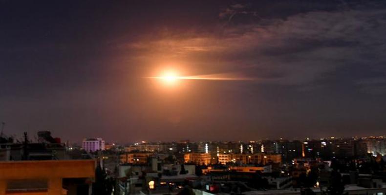 Syrian air defense systems respond to missile strike in the sky over Damascus.  (Photo: Russia’s RT Television news network)