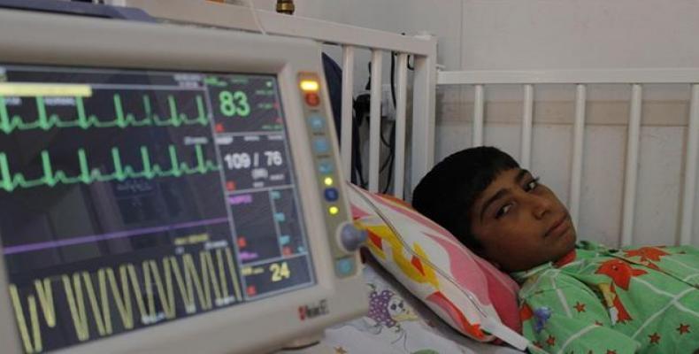 File photo shows an Iranian child undergoing treatment at a medical center. (Image: Tasnim)