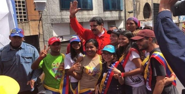 Venezuelan President Nicolas Maduro poses for photos with residents of Bolivar state after speaking to the press at the launch of his electoral campaign.  Photo