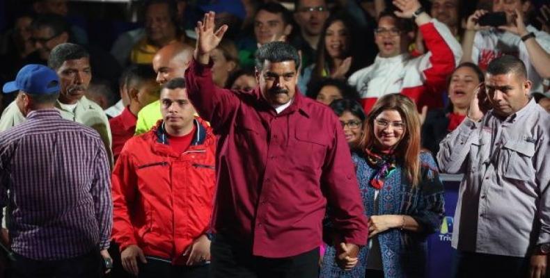 Venezuelan President Nicolas Maduro greets followers after reelection on Sunday, May 20, 2018