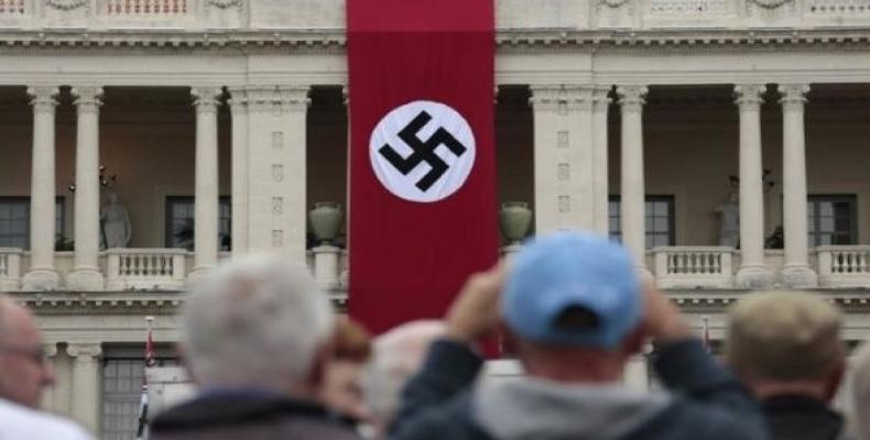 A Nazi swastika banner hangs on the facade of the Prefecture Palace in Nice which is being used as part of a movie set during the filming of a WWII film in the