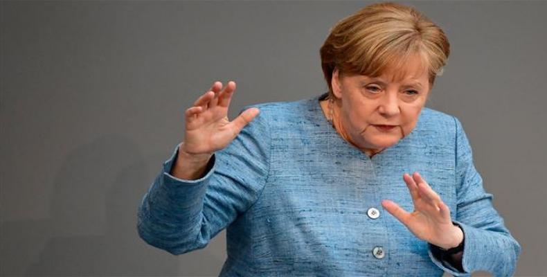 German Chancellor Angela Merkel gives a speech on her administration’s budget policy at the Bundestag (lower house of parliament) in Berlin on May 16, 2018.  Ph