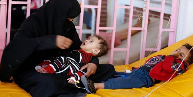 A woman sits with her sons while they are treated at a cholera treatment center in Sanaa, Yemen, on October 8, 2017.  Photo: Reuters